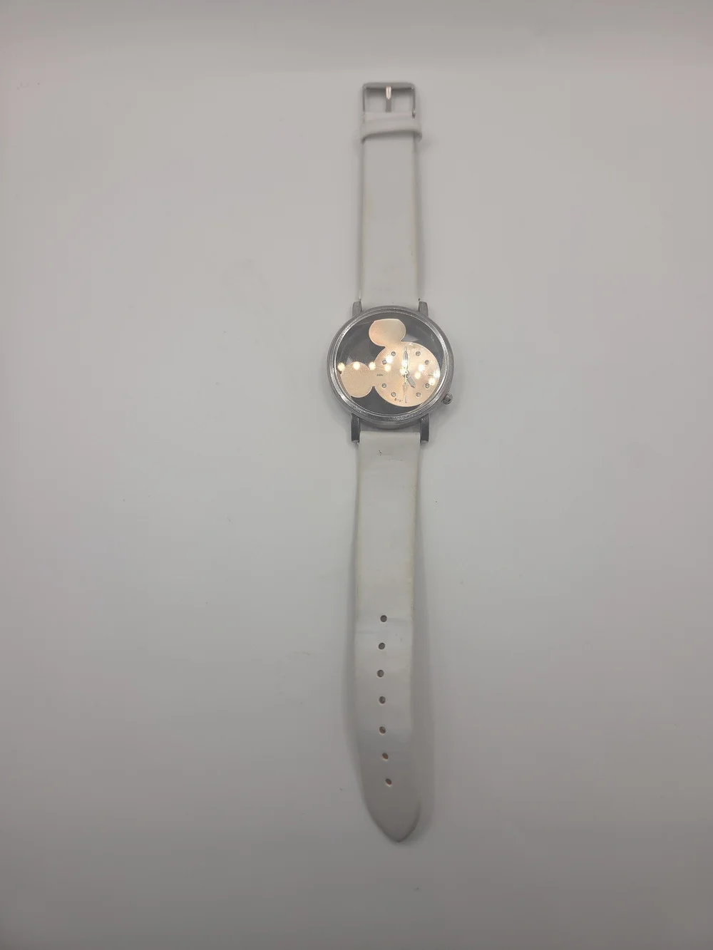 Vintage Disney Mickey Mouse wristwatch featuring a unique Mickey-shaped dial wit